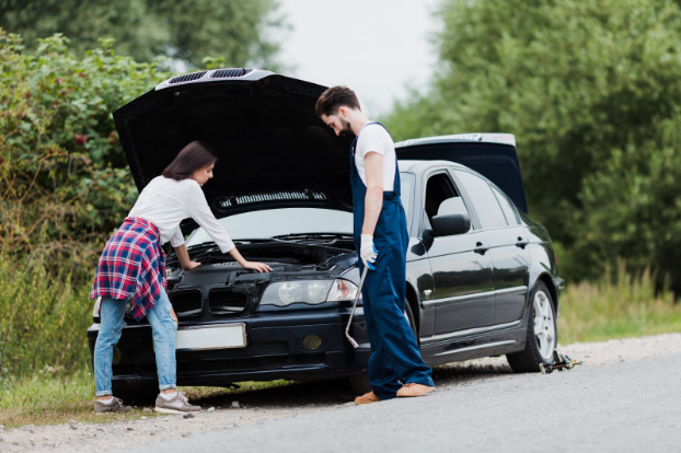 Reliable towing and recovery Salem IL by Ed Holsapple Towing flatbed service assisting drivers after roadside accidents.